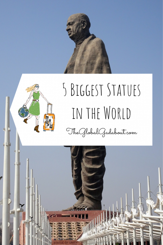 The Statue of Unity looking up from the ground with a blue sky behind. A luggage tag shape in white covers the middle of the statue with The Global Gadabout logo and the words "5 Biggest Statues in the World" and "TheGlobalGadabout.com".