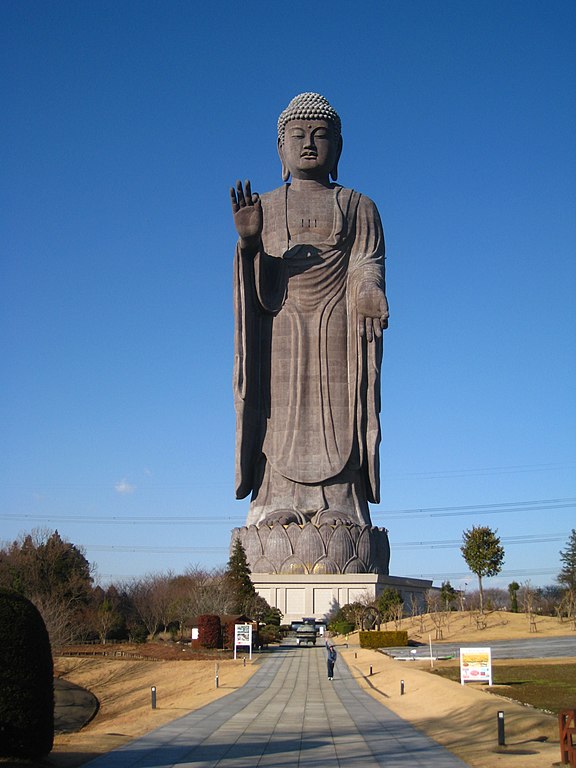 The bronze Ushiku Daibutsu statue, including the lotus platform and the road leading up to the statue.