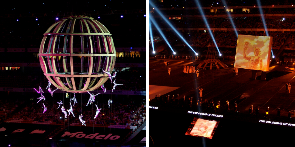 Two scenes from the unveiling ceremony of the New 7 Wonders of the World. The left shows an enormous globe with acrobatic performers suspended from it, the right shows a giant book with the Colossus of Rhodes on it, performers, and spotlights.