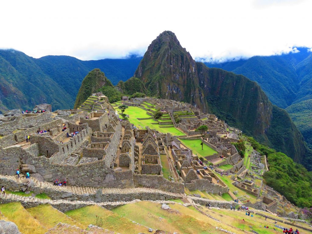 Machu Picchu citadel with mountains in the background.