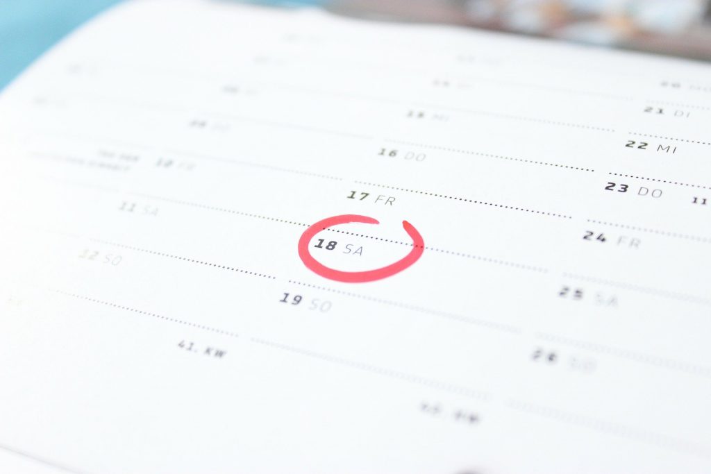 A calendar page with the 18th circled in red.